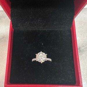 Elegant Silver and White Solitaire Ring with Brilliant Stone